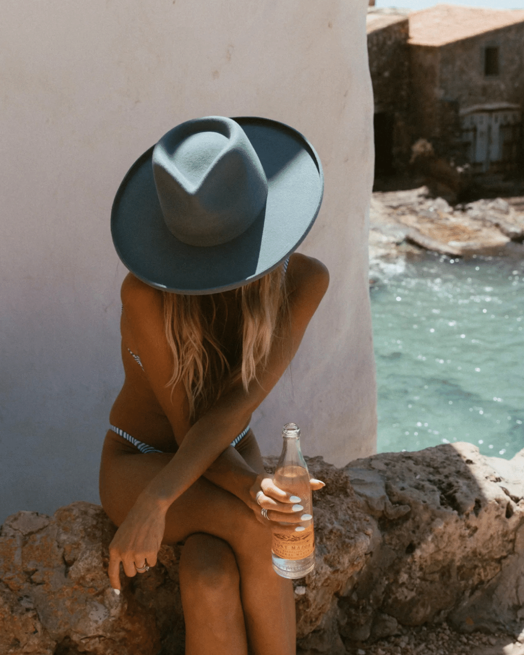 The Laguna. Augustine Hat Co. wide brim hat. Stiff Australian wool hat in blue, Blue wide brim hat, pencil brimmed hat, no lack of color, rancher hat, denim blue hat, gardening hat, dark blue wide brimmed hat, sun hat, beach hat, navy fedora, boater hat, women's headwear, Australian wool felt hat